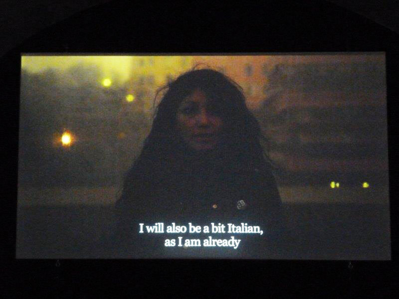 Video still of woman with subtitles: I will also be a bit Italian, as I am already